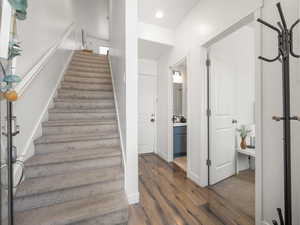 Stairs featuring LVP wood finished floors