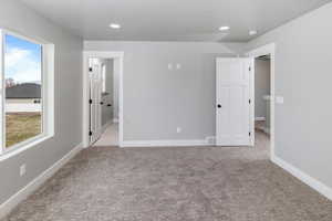 Picture of a completed bedroom in a home with the same home plans.