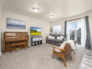 Living area with baseboards and wood finished floors