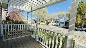 Deck with a pergola, a residential view, and a porch