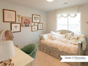 Bedroom featuring light floors and visible vents