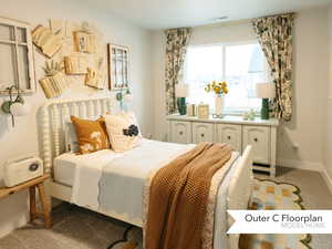 Carpeted bedroom featuring visible vents and baseboards