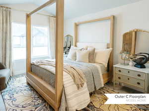 Bedroom featuring vaulted ceiling and light carpet