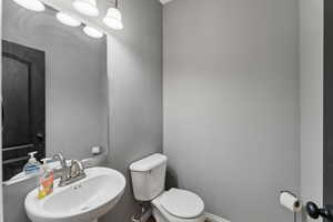 Bathroom featuring toilet and a sink