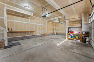 Garage featuring a garage door opener