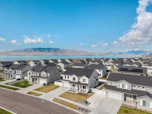 Drone / aerial view featuring a mountain view and a residential view