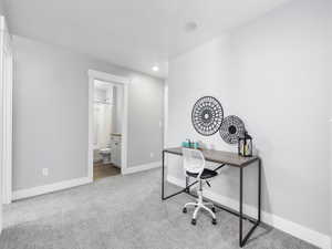 Carpeted office featuring baseboards and recessed lighting