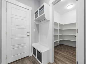 Mudroom with dark wood-style flooring