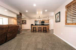 This area could be used for a dining room table, pool table, or any fun space you desire.