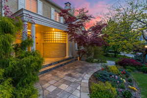 Patio terrace at dusk featuring covered porch