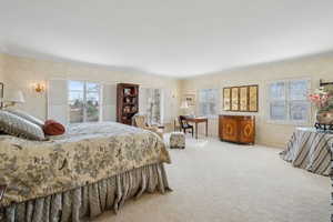 Bedroom featuring carpet and ornamental molding