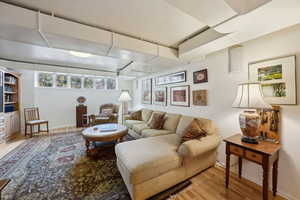 Living room with baseboards and wood finished floors
