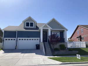 View of front of house featuring fence, a shingled roof, a garage, and concrete driveway