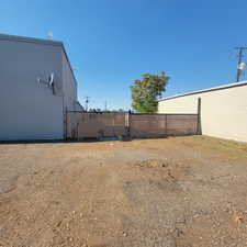 View of yard featuring fence