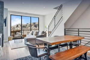 Dining space featuring wood finished floors and stairs