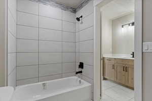 Full bathroom featuring marble finish floor, shower / bathing tub combination, vanity, and a textured ceiling