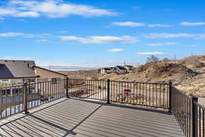 Wooden terrace featuring a mountain view