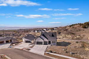 Birds eye view of property with a residential view and a mountain view