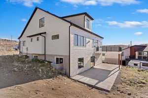 View of property exterior with a patio