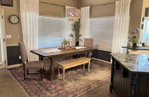 Dining space featuring plenty of natural light and baseboards