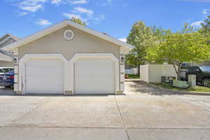 Detached garage featuring fence