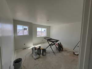 Unfurnished room with baseboards