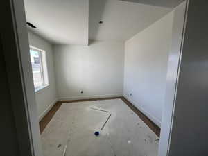 Empty room featuring baseboards