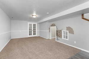 Downstairs living area. Door on the back wall leads to a bedroom that is separated from the others. Note the fun play room under the stairs