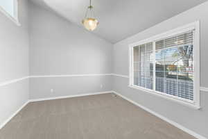 gathering room right off the front door could be a sitting room, music room, office, or library