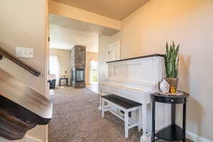 Living area featuring carpet floors and baseboards