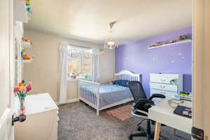 Bedroom featuring baseboards and carpet flooring