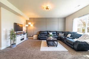 Carpeted living room with accent wall
