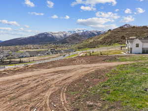 Property view of mountains with a residential view