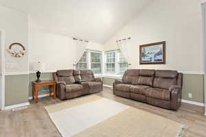 Living room featuring baseboards and light wood finished floors
