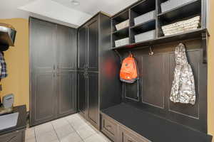 Mudroom featuring light tile patterned flooring