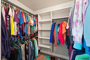 Walk in closet featuring carpet floors