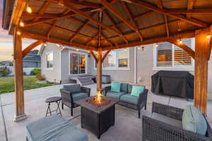 View of patio / terrace featuring a gazebo, an outdoor living space with a fire pit, and area for grilling