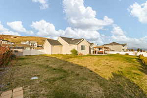 Exterior space featuring a fenced backyard and a gazebo