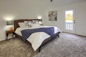 Carpeted bedroom with visible vents and access to outside