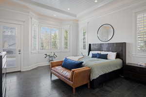 Bedroom featuring access to outside, multiple windows, crown molding, recessed lighting, and a raised ceiling