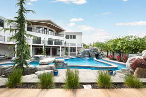 Swimming pool with an in-ground hot tub