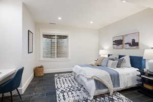 Bedroom with recessed lighting and baseboards