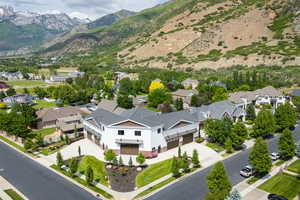 Aerial perspective of suburban area featuring a mountain backdrop
