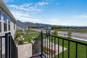 ***grass is enhanced to show what it could look like, current yard is more dirt***Balcony with a mountain view