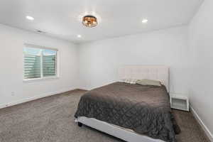 Bedroom with recessed lighting, carpet, visible vents