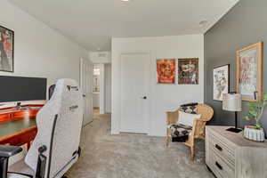 Office with visible vents and light carpet