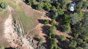 Birds eye view of property featuring a rural view