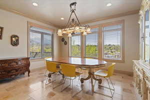 Dining room featuring baseboards, recessed lighting, and crown molding
