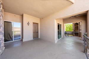 View of patio featuring exterior fireplace