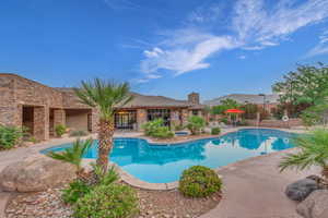 Community pool with a patio area